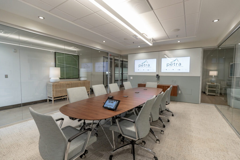 A large meeting room equipped with teleconference technology.