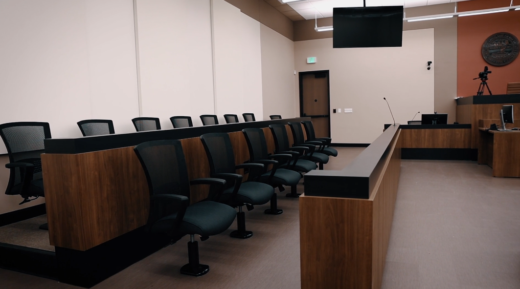 maury-co-courthouse-6 The jury box is featured prominently in one of the video feeds, ensuring comprehensive coverage of the courtroom proceedings. This setup allows for clear visibility and documentation of the jury's role in the trial.